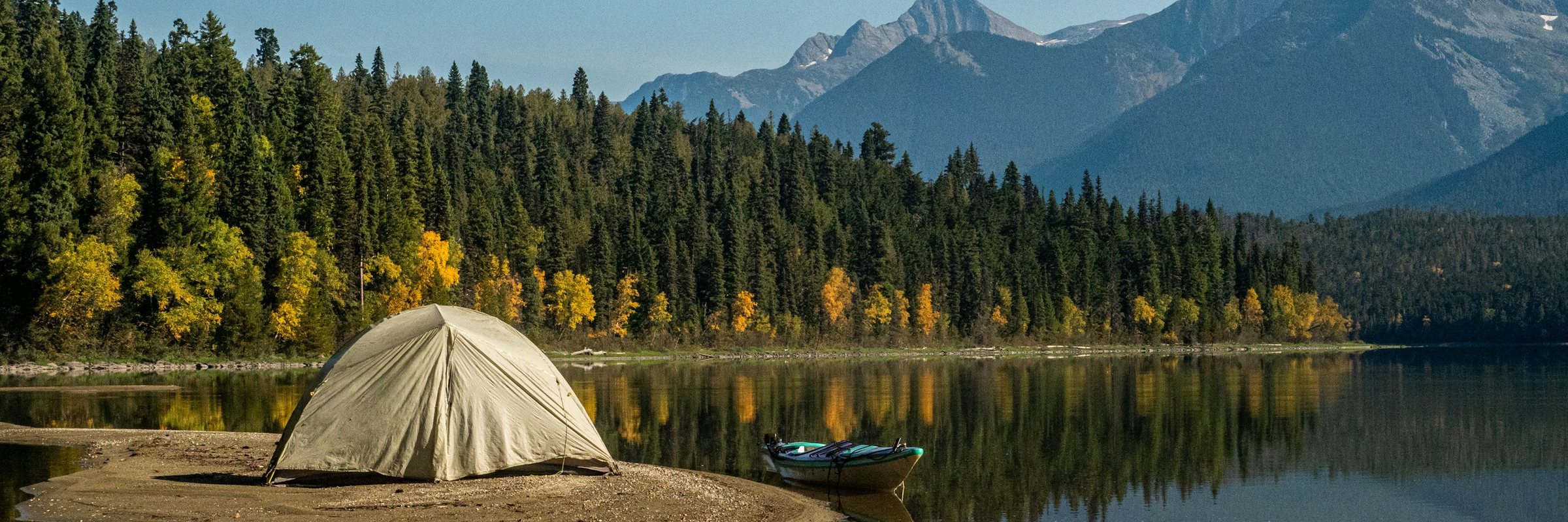 A tent pitched on a lakeshore in a BC provincial park